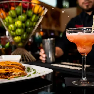 a man pouring a drink