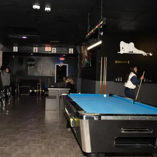 a pool table in the foreground