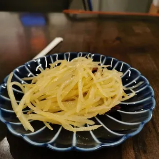 Complimentary side dish with the lunch special - sliced potatoes, a little spicy and tastes good