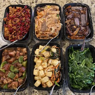 Spicy popcorn chicken, House flat noodles, eggplant, braised pork, crispy tofu, and pea shoots with garlic.  Rice not pictured.