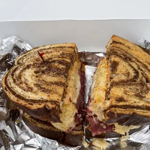 a grilled sandwich in a box