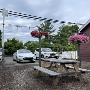 a picnic table and a car