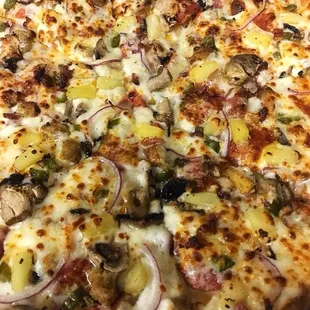 The Dank - Ranch as the base topped with pepperoni, sausage, ham, bacon, onions, mushrooms, pineapples and jalapeños.