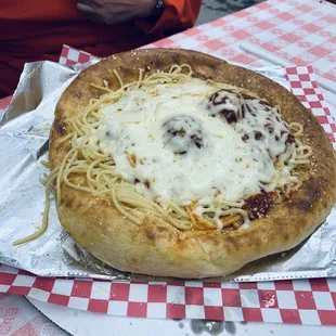 Baked spaghetti in a bread bowl. DeLishUusssssss! Get a box, you'll be mad if you don't.