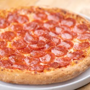 a pepperoni pizza on a plate