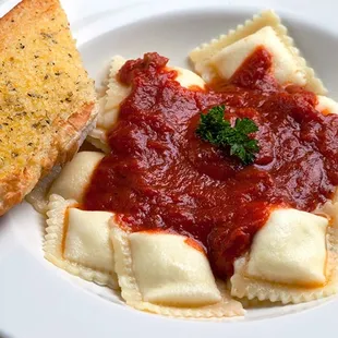 a plate of pasta and bread