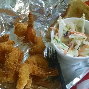 Fried shrimp combo with coleslaw and buttered, griddled bread