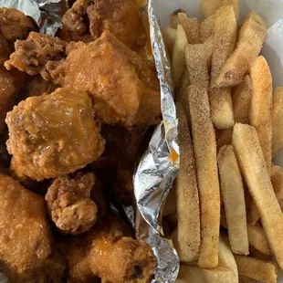 a basket of fried chicken and french fries
