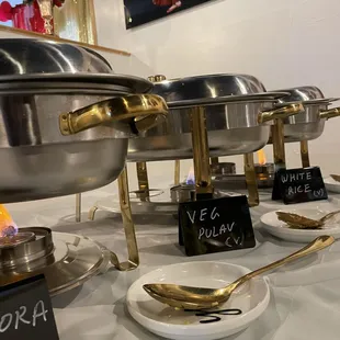 a variety of dishes on a buffet table