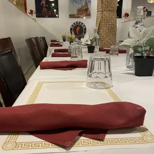 a long table with red napkins