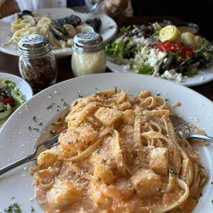 Shrimp and scallops in a champagne blush sauce   Frutti Di Mare with a white sauce   Huge Italian salad.