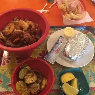 El Molcajete with grilled veggies and a baked potato