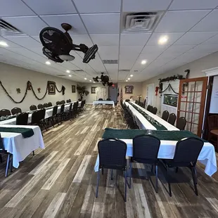 a dining room with tables and chairs