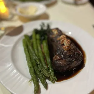 a plate of steak and asparagus