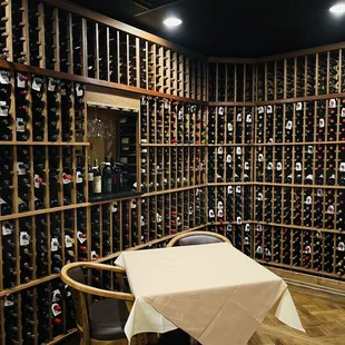a wine cellar with a table and chairs
