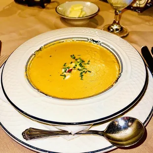 a bowl of soup on a plate