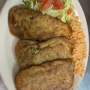 Chile Rellenos served with Rice, Beans, and a side salad