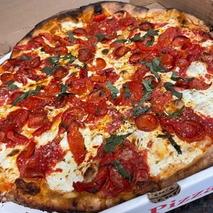 Large margarita pizza with pepperoni and roasted red peppers