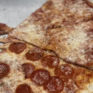 Our massive Peppino&apos;s pizza. 1/2 cheese. 1/2 pepperoni.