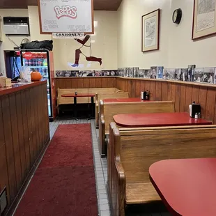 Seating near counter and walls lined with celebrity photos