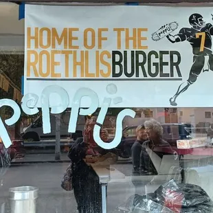 a sign in the window of a restaurant