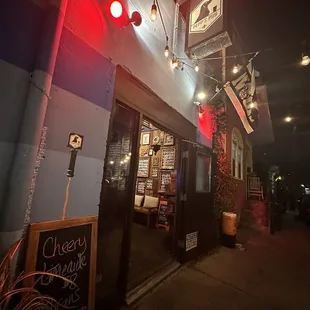 the outside of the pub at night