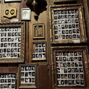 a wall of photos and a clock