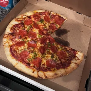 a pepperoni pizza in a box