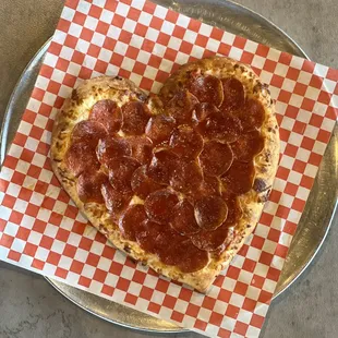 Show your love this valentines day with a Heart shaped Pizza!