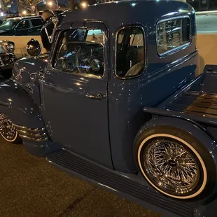 a blue truck parked in a parking lot