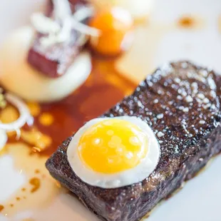 Snake River Farms "Calotte De Bceuf" | Dry-Aged Beef "Chorizo" | Sunny Side Up Quail Egg | "Pommes Purée | Marinated Sungold Tomatoes
