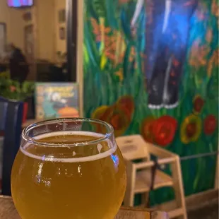 a glass of beer on a table