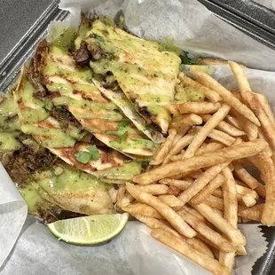 Beef birriadilla with cheese, avocado, salsa, and sour cream