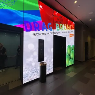 a woman taking a picture of a display