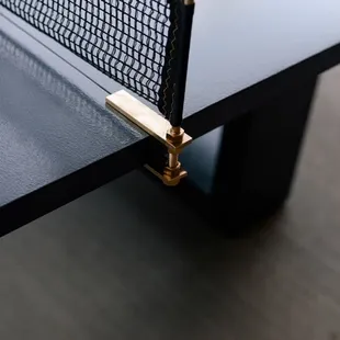 Custom concrete ping pong table with brass inlay -- Midtown, Oklahoma City