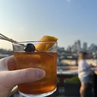a person holding a drink