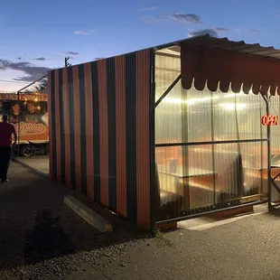 The covered dining area, with air and 7 booths