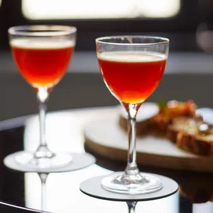 two glasses of wine on a table