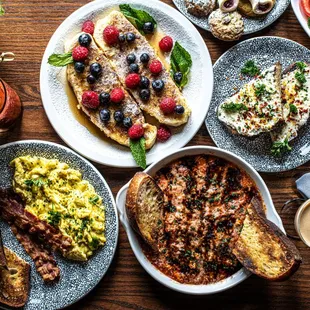 a variety of breakfast foods on a table