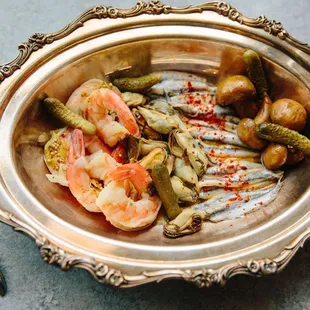 a bowl of fish and vegetables