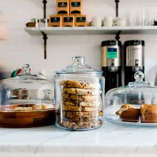 a counter with a variety of pastries on it