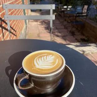 Flat white on the patio.