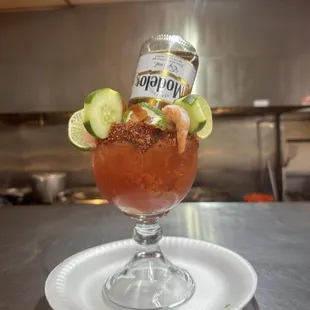 a bloody cocktail with a bottle of beer