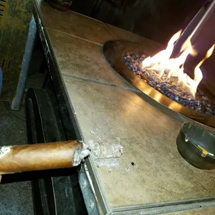 a person holding a cigar