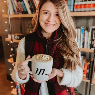 Javalanche hot latte with whipped topping.