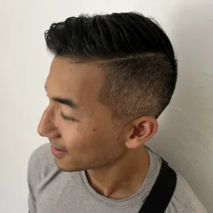 Fade with side part for coarse and naturally wavy hair