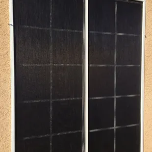 Solar screen.  Here's to hoping it keeps our bedrooms cooler