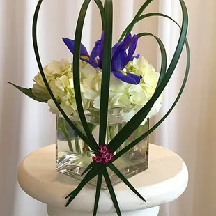 Heart Strung: Purple Iris and hydrangea with arching heart.