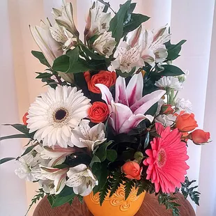 Starlit Delight - Beautiful, lush arrangement of gerbera daisies, alstroemeria, and spray roses with elegant stargazer lilies.