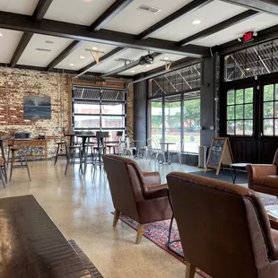 seating area with tables and chairs